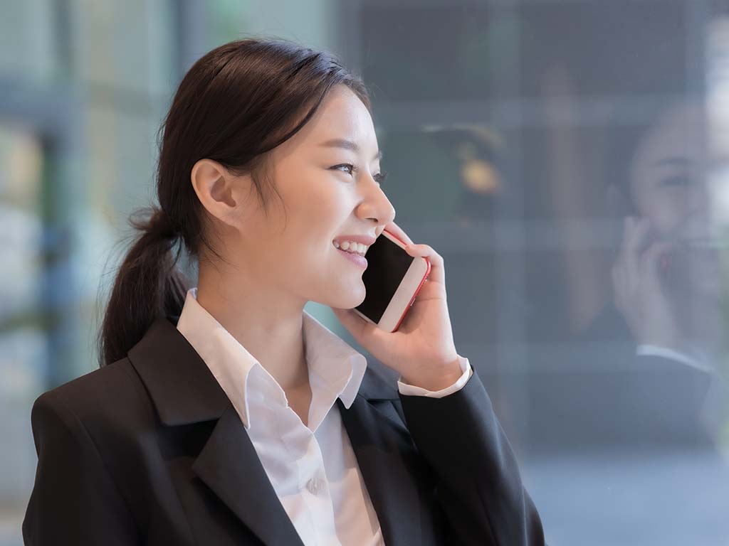 Asian businesswoman talking on mobile phone